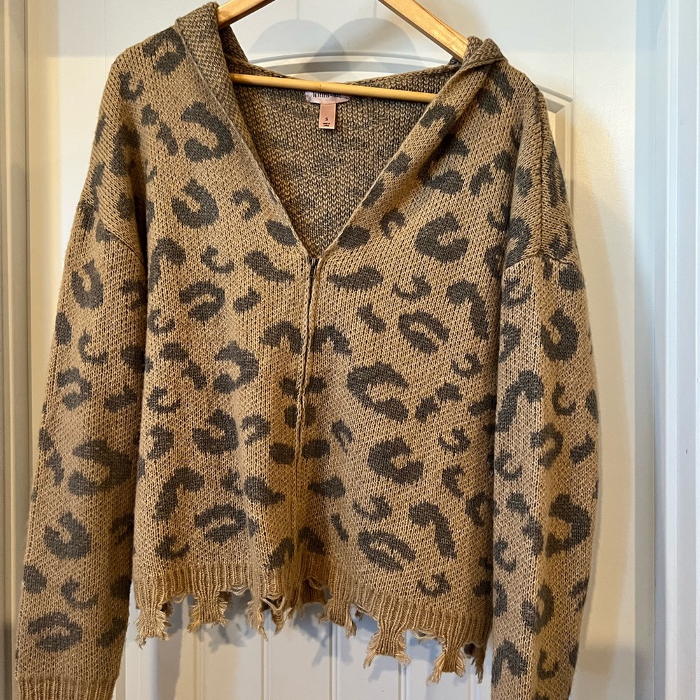 Size small, zipped up distressed bottom sweater with hoodie!